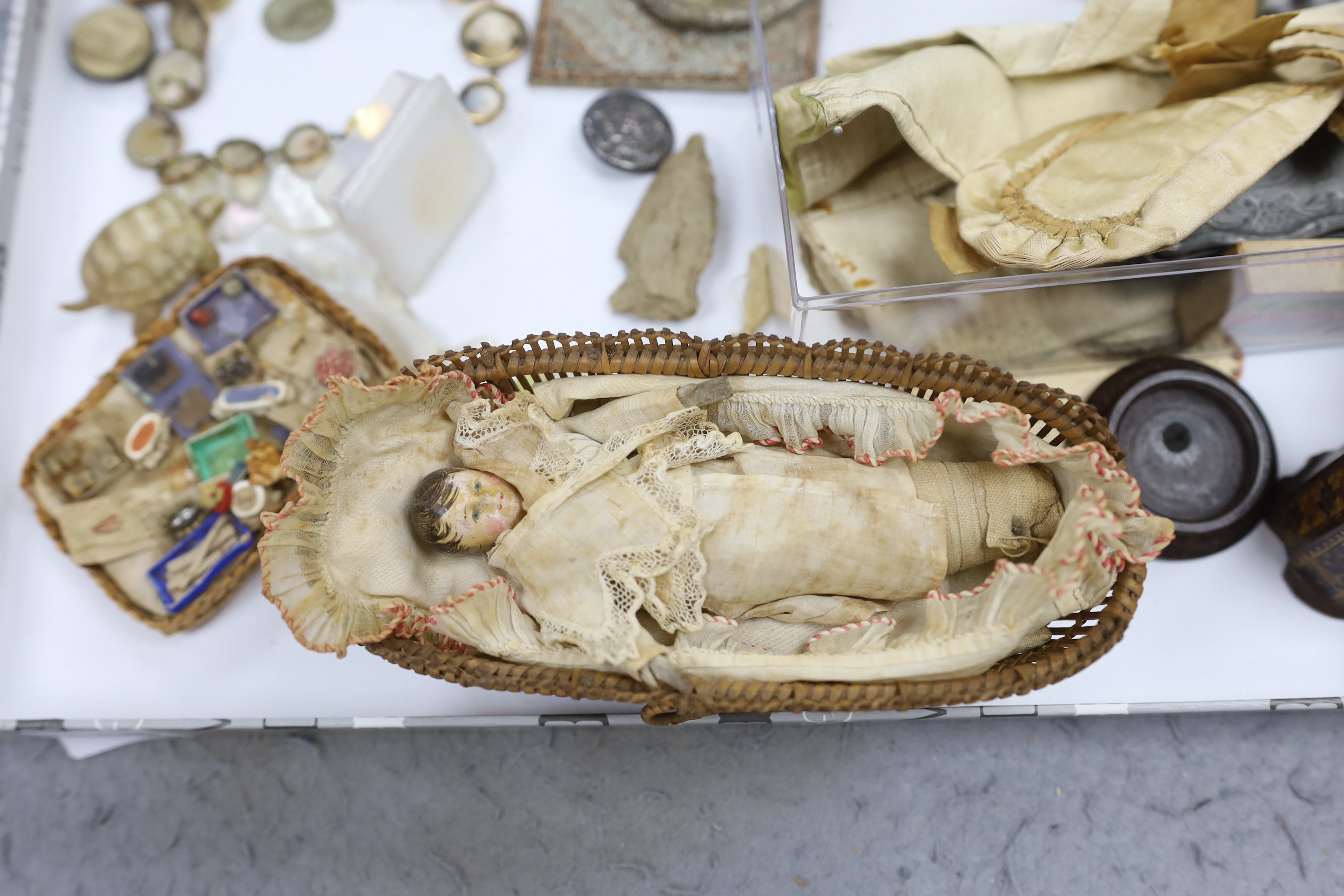 A collection of cabinet curiosities, including carved lava portrait medallions, porcelain scent bottles, etc. (a large quantity)